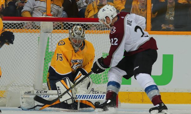 Pekka Rinne #35 of the Nashville Predators makes a save on Colin Wilson #22 of the Colorado Avalanc...