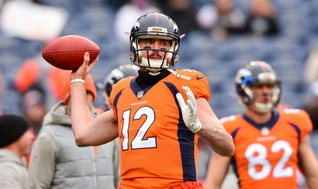 DENVER, CO - DECEMBER 31:  Quarterback Paxton Lynch #12 of the Denver Broncos throws as he warms up...