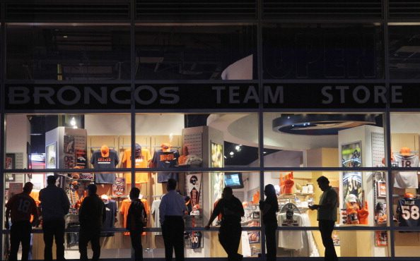 Fans await the 6 a.m. opening of the Denver Broncos Team Store at Sports Authority Field at Mile Hi...