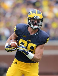 Jake Butt #88 of the Michigan Wolverines runs for a short gain during the first quarter of the game against the Oregon State Beavers on September 12, 2015 at Michigan Stadium in Ann Arbor, Michigan. (Photo by Leon Halip/Getty Images)