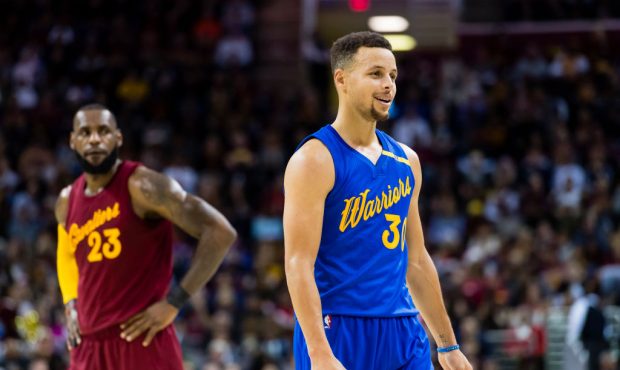 Stephen Curry (30) of the Golden State Warriors and LeBron James (23) of the Cleveland Cavaliers pa...