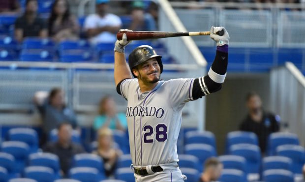 Nolan Arenado #28 of the Colorado Rockies reacts after striking out in the first inning against the...