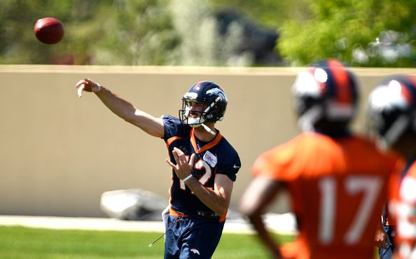 Denver Broncos quarterback Paxton Lynch (12) fires a pass on the first day of Broncos OTA's at the ...