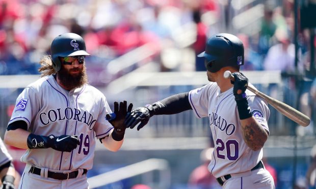 WASHINGTON, DC - APRIL 14: Charlie Blackmon #19 of the Colorado Rockies celebrates with Ian Desmond...