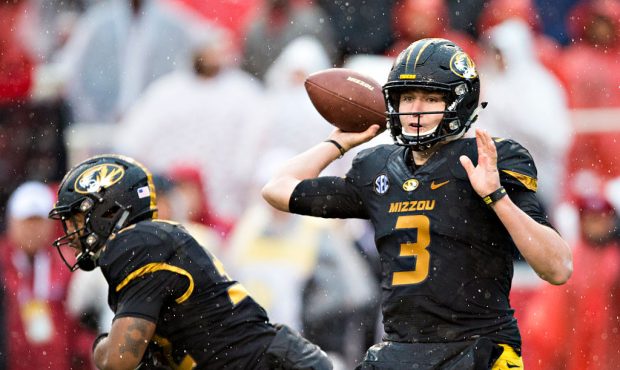 FAYETTEVILLE, AR - NOVEMBER 27:  Drew Lock #3 of the Missouri Tigers throws a pass against the Arka...