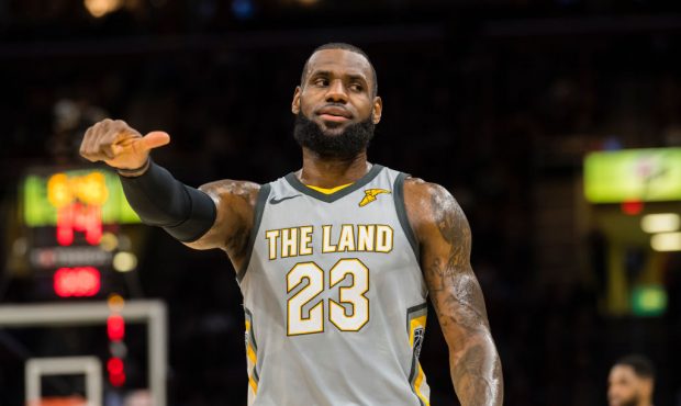 LeBron James #23 of the Cleveland Cavaliers jokes with his former teammate Richard Jefferson #22 of...