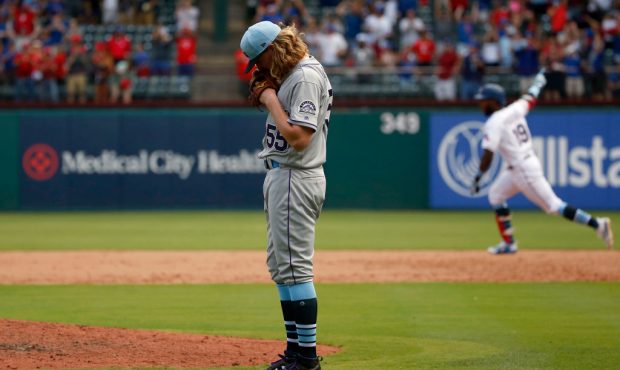 Jon Gray (55) of the Colorado Rockies reacts after giving up a three-run home run to Jurickson Prof...
