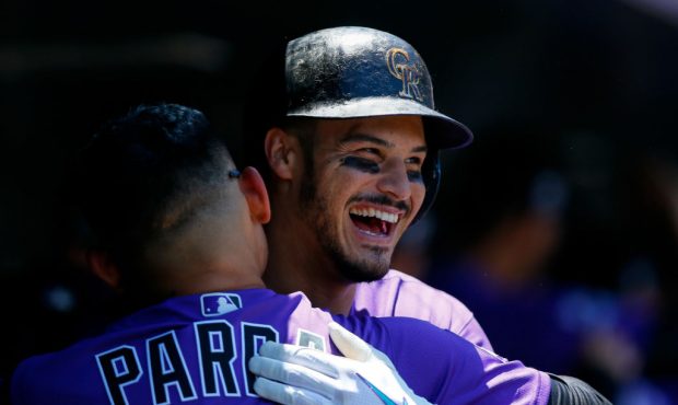 Colorado Rockies third baseman Nolan Arenado (28) celebrates his three-run home run with outfielder...