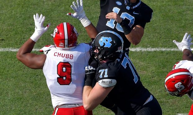 CHAPEL HILL, NC - NOVEMBER 25:  Mitch Trubisky #10 of the North Carolina Tar Heels throws over Brad...