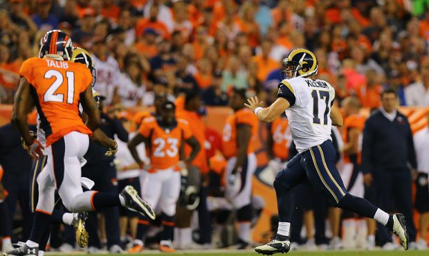DENVER, CO - AUGUST 27: Quarterback Case Keenum #17 of the Los Angeles Rams runs with the football ...