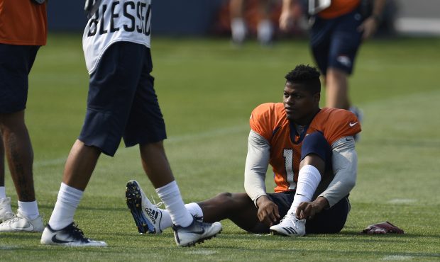 Denver Broncos wide receiver Carlos Henderson #11 laces up his cleats at Dove Valley August 04, 201...