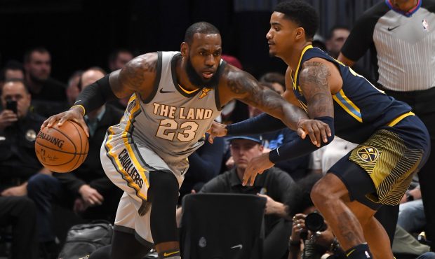 Cleveland Cavaliers forward LeBron James (23) looks to drive past Denver Nuggets guard Gary Harris ...