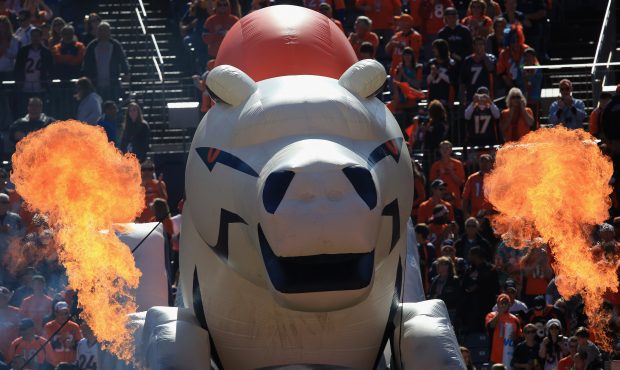 DENVER, CO - OCTOBER 13:  Flames billow around the Bronco as the Denver Broncos take the field to f...