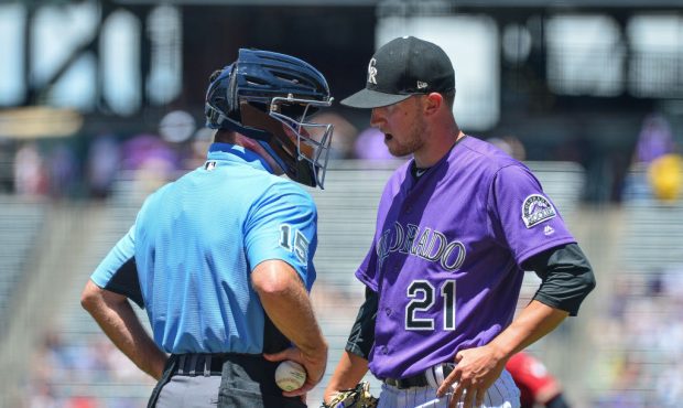 Kyle Freeland (21) of the Colorado Rockies has a word with umpire Ed Hickox after the top of the fi...
