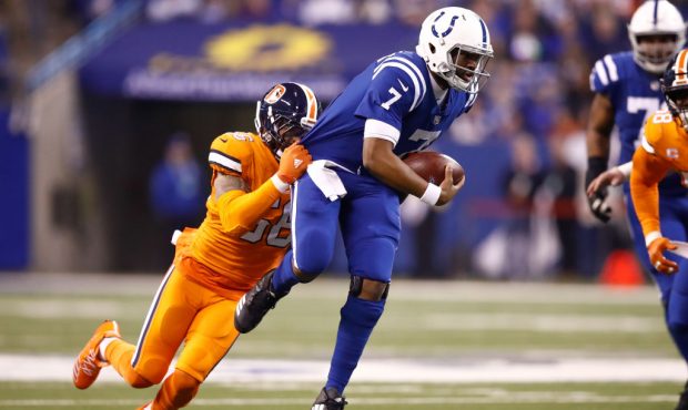 INDIANAPOLIS, IN - DECEMBER 14:  Jacoby Brissett #7 of the Indianapolis Colts is tackled by Shane R...
