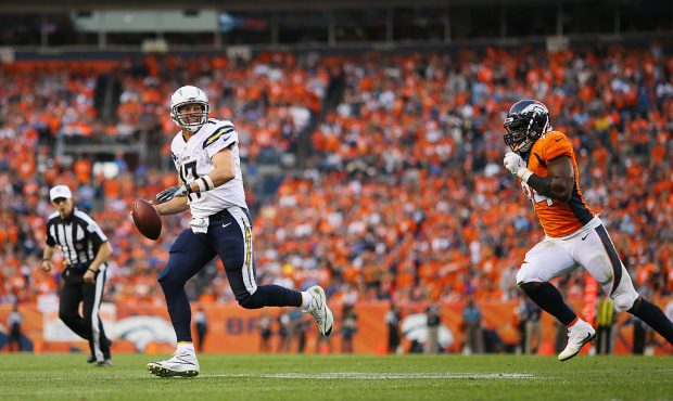 DENVER, CO - OCTOBER 30:  Quarterback Philip Rivers #17 of the San Diego Chargers scrambles away fr...