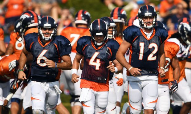Quarterback's Chad Kelly #6, Case Keenum #4 and Paxton Lynch #12 of the Denver Broncos heading to t...