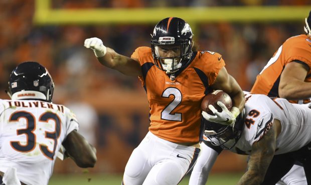Phillip Lindsay #2 rushes up field as the Denver Broncos take on the Chicago Bears during the secon...