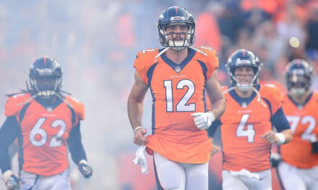 Quarterback Paxton Lynch #12 of the Denver Broncos runs onto the field with teammates as the team i...