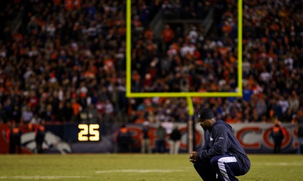 DENVER, CO - DECEMBER 18:  Injured safety Brian Dawkins #20 of the Denver Broncos reacts on the fie...