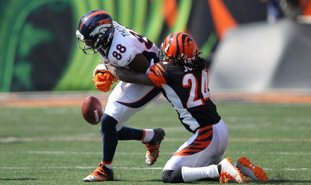 CINCINNATI, OH - SEPTEMBER 25:  Adam Jones #24 of the Cincinnati Bengals strips the ball from Demar...