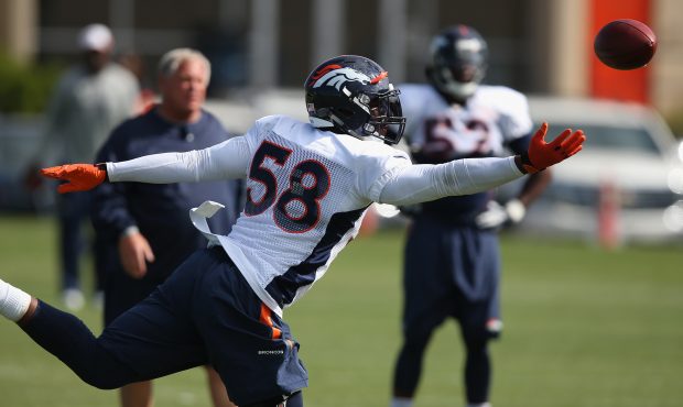 ENGLEWOOD, CO - AUGUST 05:  Outside linebacker Von Miller #58 of the Denver Broncos reaches for the...