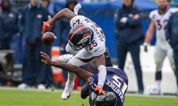 BALTIMORE, MD - SEPTEMBER 23: Chris Harris #25 of the Denver Broncos breaks up a pass intended for ...