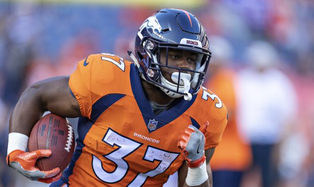 Royce Freeman (37) of the Denver Broncos warms up before a game against the Minnesota Vikings durin...