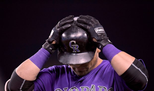 Gerardo Parra #8 of the Colorado Rockies reacts to his ground ball out during the fourth inning aga...