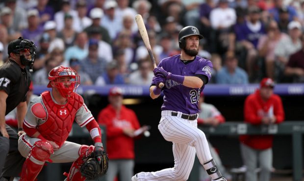 DENVER, CO - SEPTEMBER 27:  David Dahl #26 of the Colorado Rockies hits a RBI triple in the seventh...