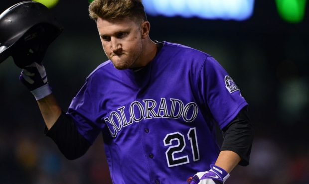 DENVER, CO - AUGUST 6: Kyle Freeland #21 of the Colorado Rockies reacts after popping out on a bunt...