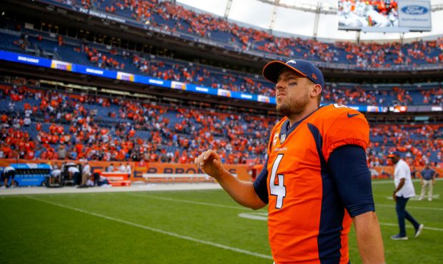 DENVER, CO - SEPTEMBER 16:  Quarterback Case Keenum #4 of the Denver Broncos walks off the field af...