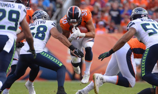 DENVER, CO - SEPTEMBER 9:  Jordan Moore #30 of the Denver Broncos runs for a first down against the...