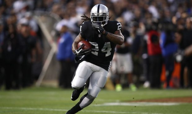 OAKLAND, CA - SEPTEMBER 10:  Marshawn Lynch #24 of the Oakland Raiders rushes with the ball against...