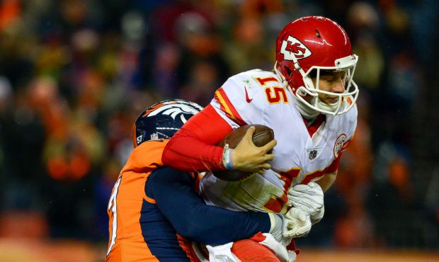 DENVER, CO - DECEMBER 31:  Quarterback Patrick Mahomes #15 of the Kansas City Chiefs is sacked by d...