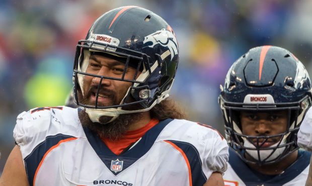 BALTIMORE, MD - SEPTEMBER 23: Domata Sr. Peko #94 of the Denver Broncos sings during a break in the...