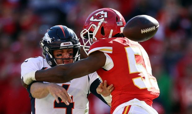 KANSAS CITY, MO - OCTOBER 28:  Quarterback Case Keenum #4 of the Denver Broncos loses the ball as h...
