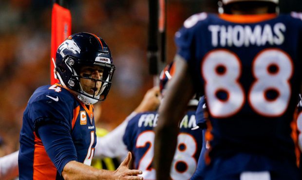 DENVER, CO - OCTOBER 1:  Quarterback Case Keenum #4 of the Denver Broncos celebrates after a second...