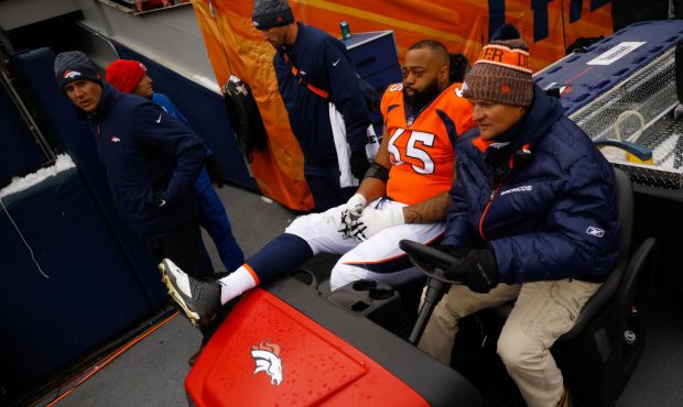 DENVER, CO - OCTOBER 14:  Guard Ronald Leary #65 of the Denver Broncos is carted off the field duri...