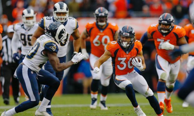 DENVER, CO - OCTOBER 14:  Running back Phillip Lindsay #30 of the Denver Broncos runs with the foot...
