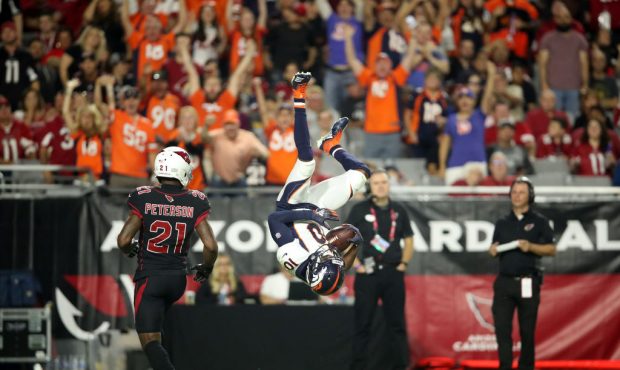 GLENDALE, AZ - OCTOBER 18:  Wide receiver Emmanuel Sanders #10 of the Denver Broncos flips in to th...