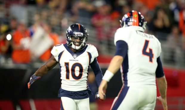 GLENDALE, AZ - OCTOBER 18:  Wide receiver Emmanuel Sanders #10 reacts with teammate quarterback Cas...