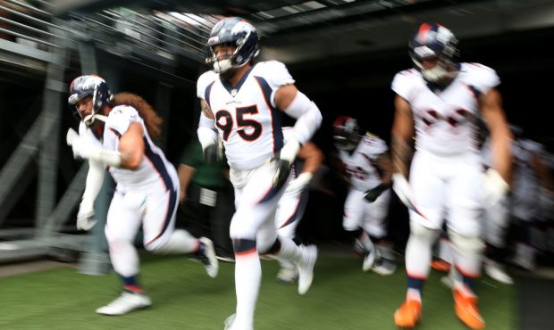 EAST RUTHERFORD, NEW JERSEY - OCTOBER 07:  The Denver Broncos take the field prior to the game agai...
