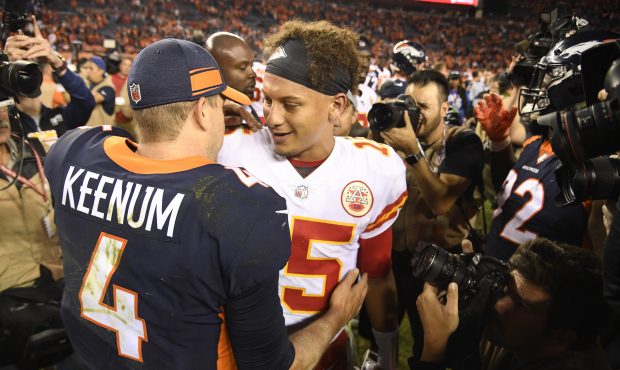 Denver Broncos quarterback Case Keenum (4) and Kansas City Chiefs quarterback Patrick Mahomes (15) ...