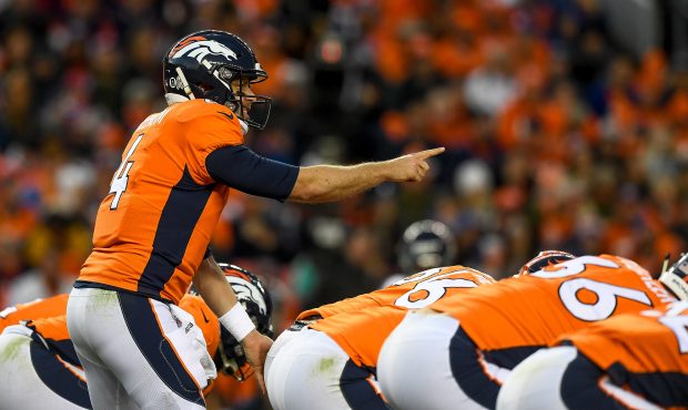 Quarterback Case Keenum #4 of the Denver Broncos runs the offense against the Houston Texans at Bro...