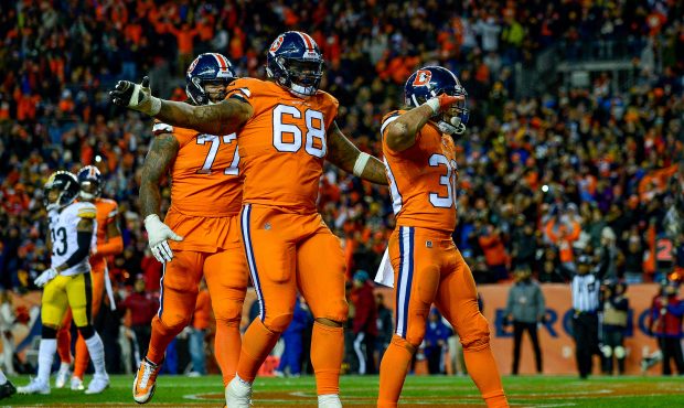Running back Phillip Lindsay #30 of the Denver Broncos celebrates after scoring a fourth quarter to...