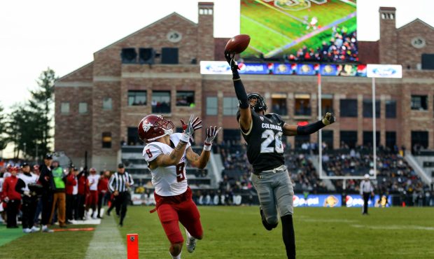 Defensive back Isaiah Oliver #26 of the Colorado Buffaloes defends a pass away from wide receiver G...