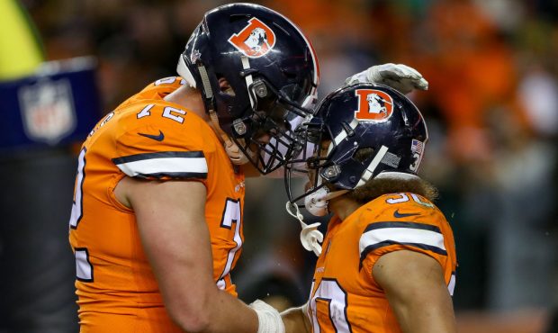DENVER, CO - NOVEMBER 25:  Running back Phillip Lindsay #30 of the Denver Broncos celebrates with o...
