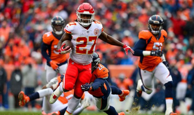 DENVER, CO - DECEMBER 31:  Running back Kareem Hunt #27 of the Kansas City Chiefs breaks away for a...