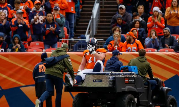 DENVER, CO - NOVEMBER 4:  Center Matt Paradis #61 of the Denver Broncos puts his hand on his head a...